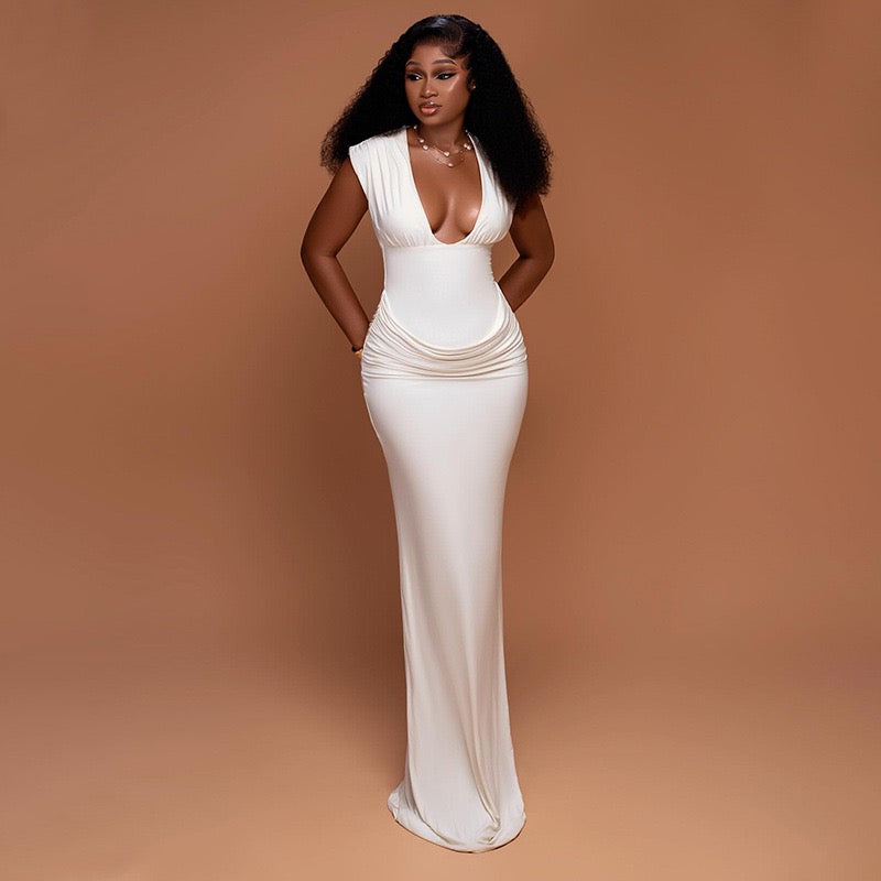 Shaping pleated full-skirted dress with a sexy V-neck and elegant style.