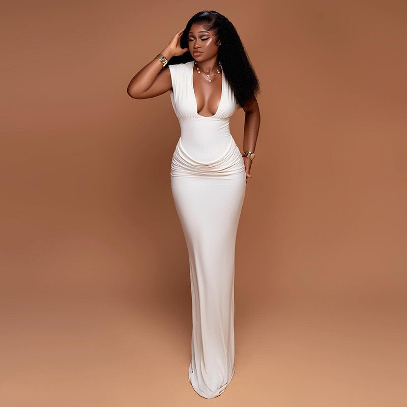 Shaping pleated full-skirted dress with a sexy V-neck and elegant style.
