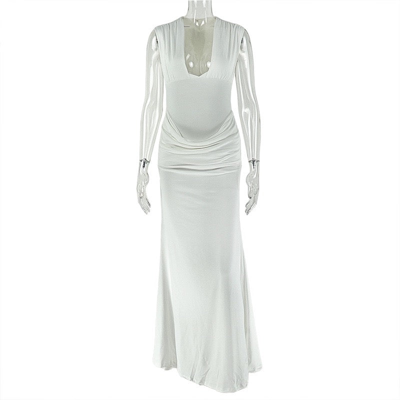 Shaping pleated full-skirted dress with a sexy V-neck and elegant style.