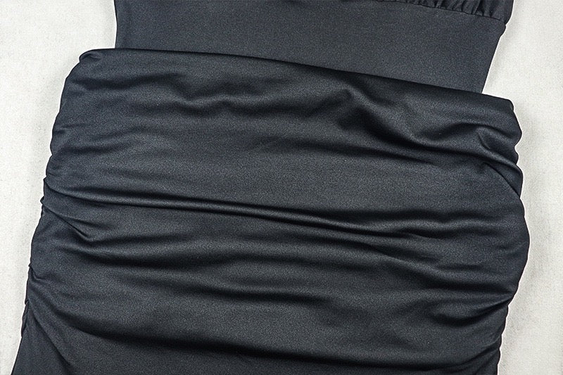 Shaping pleated full-skirted dress with a sexy V-neck and elegant style.