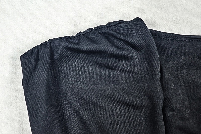 Shaping pleated full-skirted dress with a sexy V-neck and elegant style.