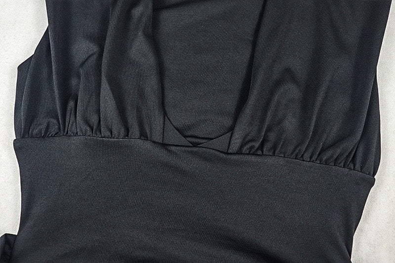 Shaping pleated full-skirted dress with a sexy V-neck and elegant style.