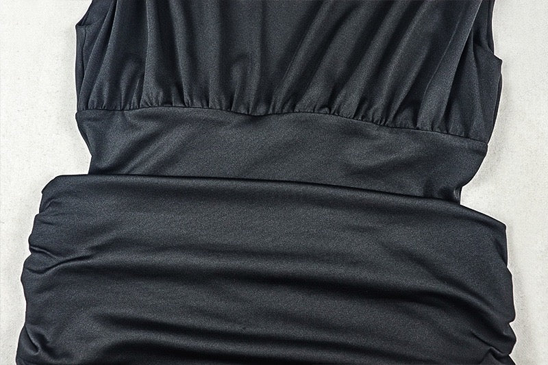 Shaping pleated full-skirted dress with a sexy V-neck and elegant style.